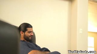 Restrained bdsm hunk blowing doms penis